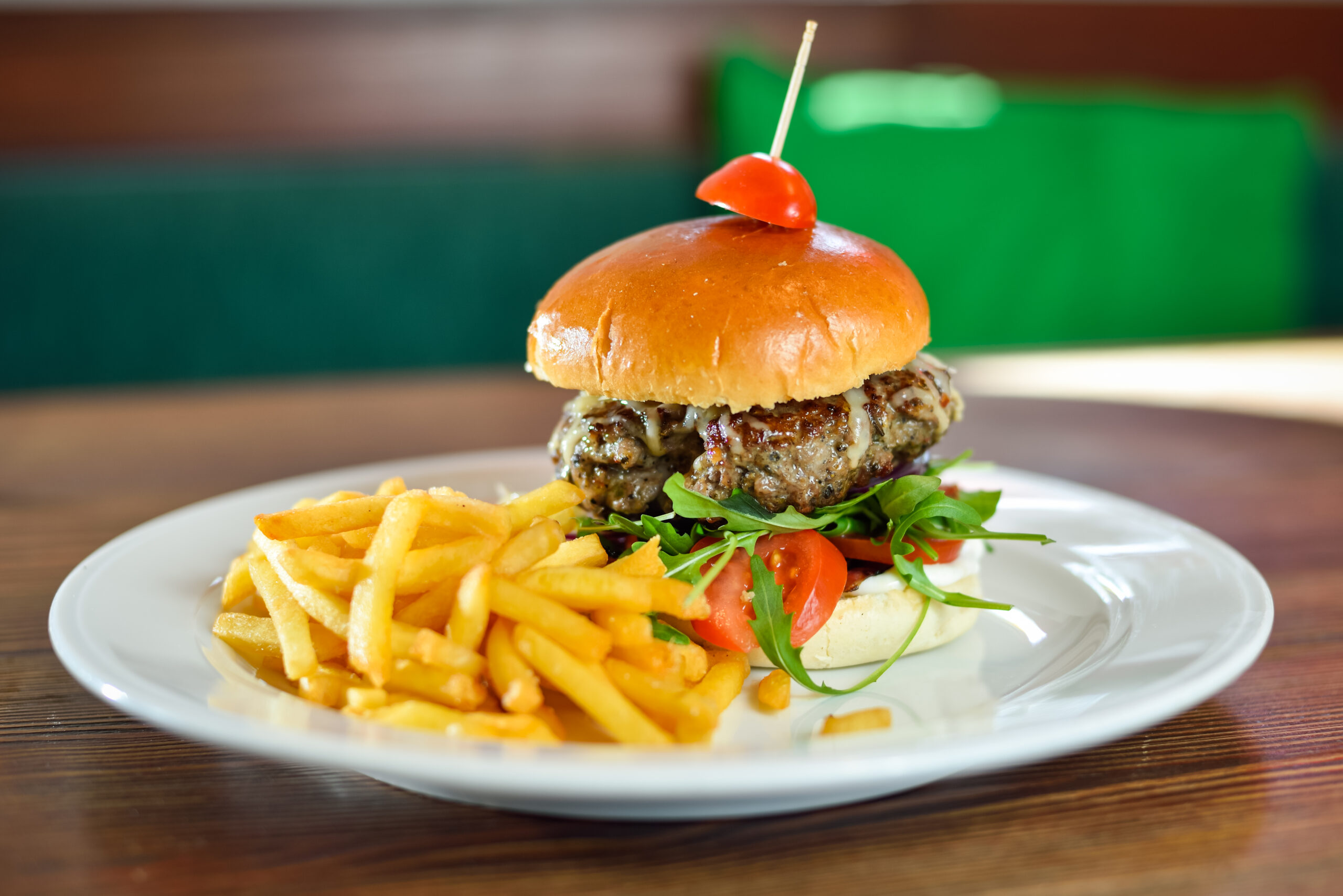burger with French fries cutlet with cheese and tomato